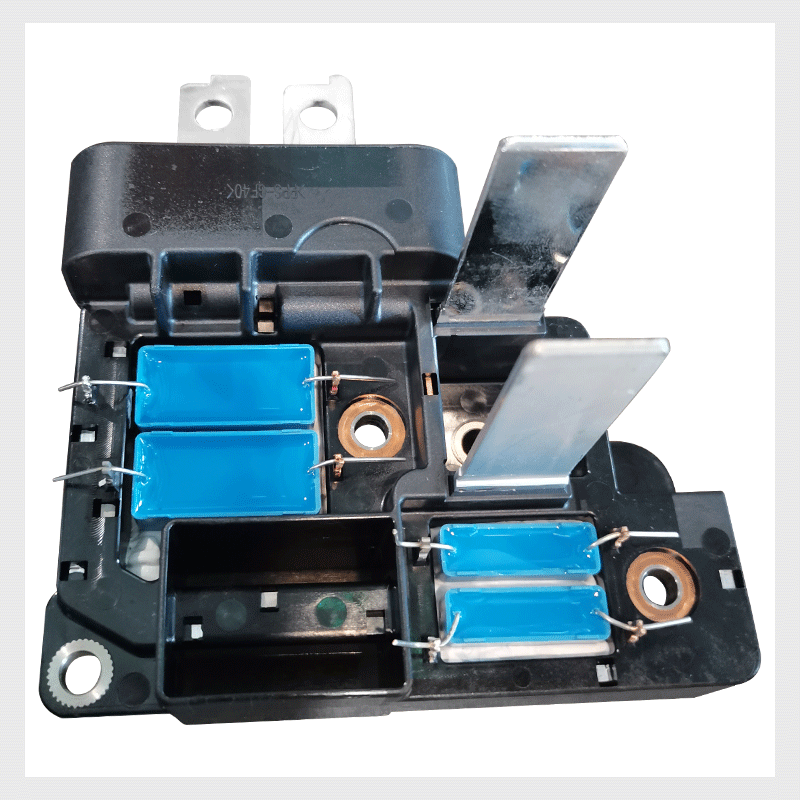 Capacitor lead clamping soldering